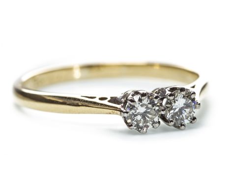 DIAMOND TWO STONE RING, the round brilliant cut diamonds totalling approximately 0.30 carats, marks worn, size R, 2.8g
