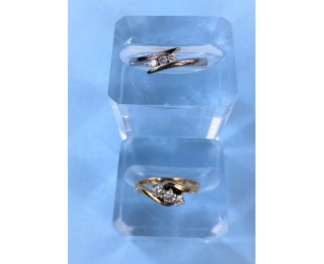 A 9 carat gold ring set 3 small diamonds and another 9 carat white gold ring set with 3 small diamonds, 3.75gm Good condition