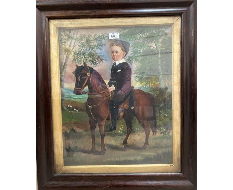 A Victorian rosewood veneered cushion frame containing an overpainted portrait of a boy on a pony, 71 x 60 cm