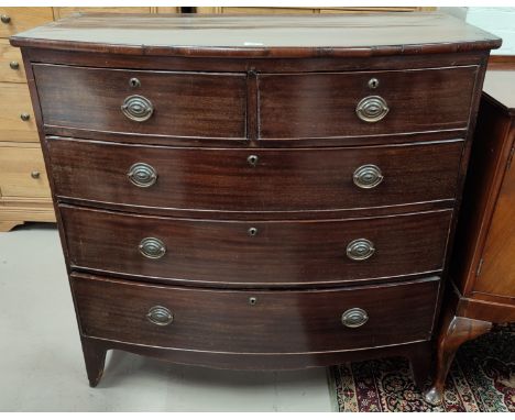 An early 19th century mahogany bow front chest of 3 long and 2 short drawers with brass drop handles, on bracket feet, width 