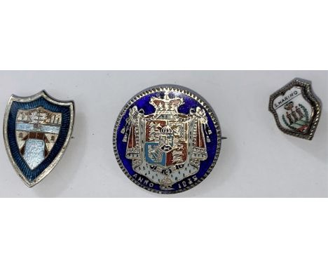 A white metal enamel shield shaped badge, an enamelled Georgian 1835 coin brooch and another badge 