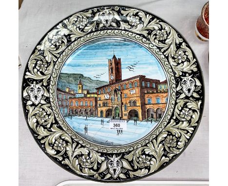 A continental large pottery wall plaque:  town square scene; a Poole vase; decorative china and glass 