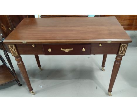 A "The House of Faberge" Imperial 5 in 1 games table Georgian style walnut double flap games table opening to reveal chess an