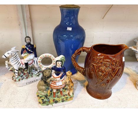 A John Bull Britannia jug with brown glaze; a modern pair of Staffordshire figures; an oriental pottery baluster table lamp i