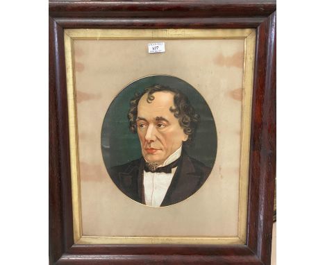A Victorian rosewood veneered cushion frame containing a chromolithograph portrait of Benjamin Disraeli, 67 x 57 cm overall 