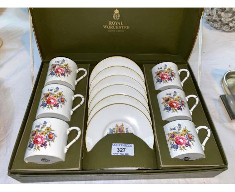 A Royal Worcester boxed six setting coffee service with floral decoration 