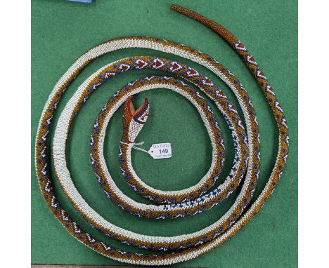 A Turkish prisoner of war work beaded snake inscribed TURKISH PRISONER, 1917, nearly 3.5m length!!&nbsp;&nbsp;In good conditi