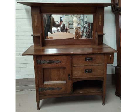 An Edwardian inlaid oak sideboard in the Arts &amp; Crafts style with mirror back, side cupboard  on strap hinges, 2 drawers 