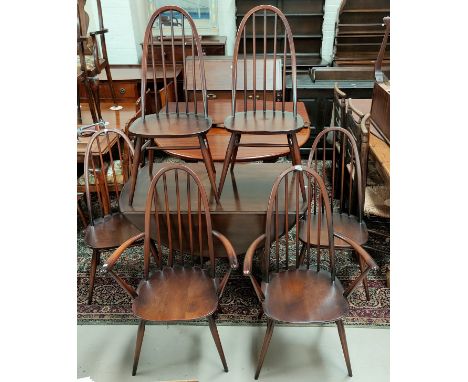 An Ercol dark oak dining suite comprising drop leaf table and 6 (4 + 2) chairs 