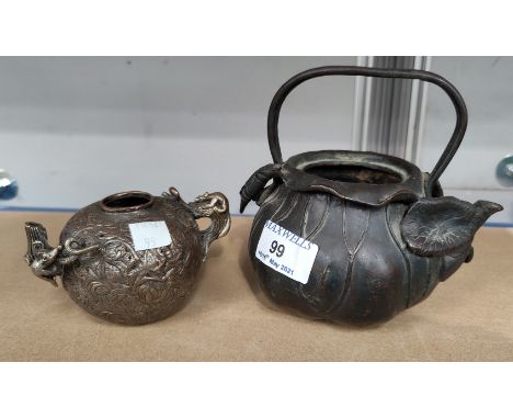 A 19th century Japanese bronze teapot of naturalistic form with leaf mounts, length 15 cm (no lid); an oriental small spheric