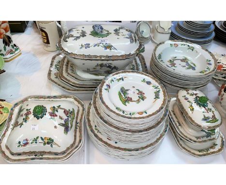 A 19th century Spode dinner service decorated with flowering branches etc including tureens, platters and various sizes of pl