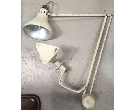 A vintage industrial architect wall mounting angle poise lamp with counter weight. 
