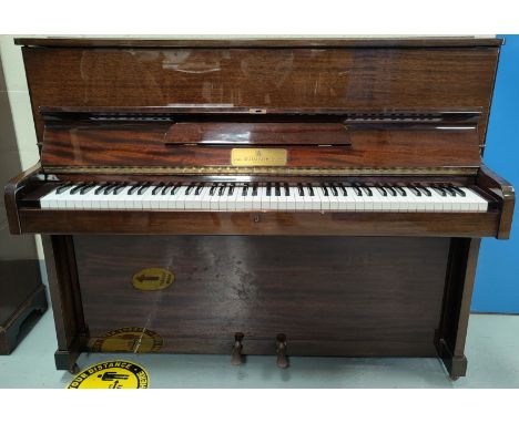 A modern small piano in mahogany case, iron framed and overstrung, by John Broadwood &amp; Sons, with box seat stool,&nbsp;In