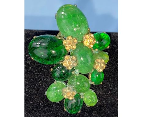 A vintage Christian Dior brooch, various oval jade coloured stones in a gilt setting. 
