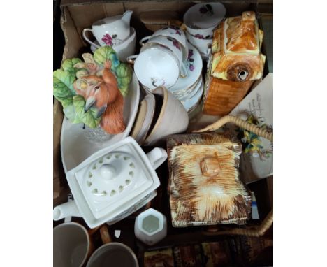 A part tea service decorated with roses and a selection of cottage ware 