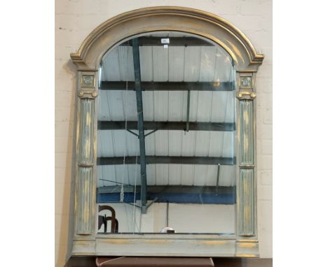 An arch top mirror in silvered finish frame 