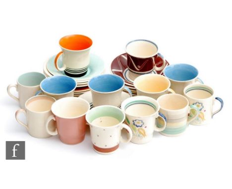 A collection of assorted 1930s and later Susie Cooper coffee cans and saucers to include Tango, Dresden Spray and Wedding Ban