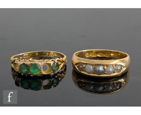 An 18ct hallmarked five stone split pearl ring of plain form, weight 4.2g, Chester 1885, with a 15ct emerald five stone ring 