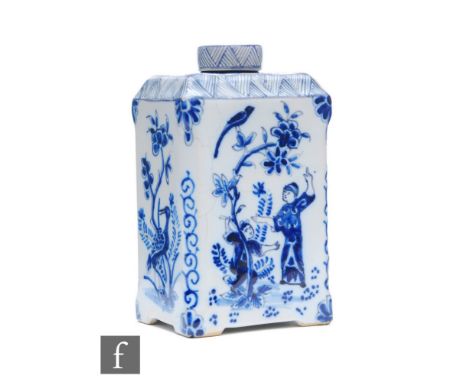 An 18th Century Delft square tea caddy, painted in tones of blue in the Chinoiserie taste with Chinese figures and birds, pai