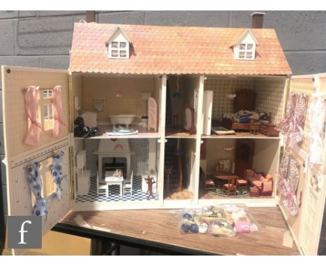 A contemporary two storey dolls house with hinged roof attic, split front opening and interior walls with doors, painted in p