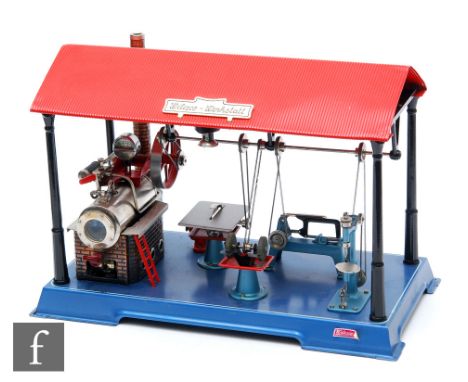 A Wilesco Werkstatt live steam plant with static engine and various tools and saws, length 46cm. 