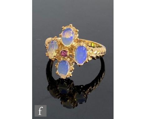 A Georgian style 9ct hallmarked water opal and ruby cluster ring, central ruby with four surrounding oval opals all to feathe