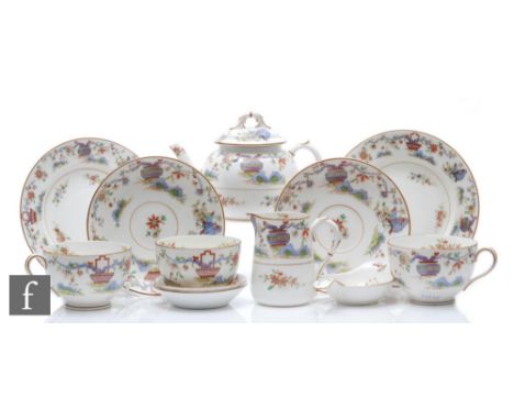 A 1920s Royal Worcester tea for two decorated in a Chinoiserie pattern with vases of flowers and butterflies, comprises teapo