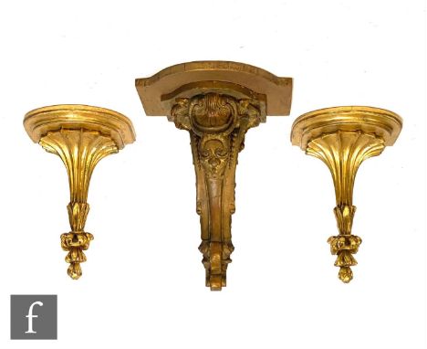 A 19th Century gilt wood wall bracket, later top and a pair of 20th Century gilt fluted wall brackets, height 35cm. (3) 