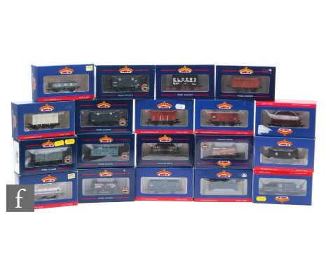 Nineteen OO gauge Bachmann items of rolling stock, to include plank wagons, ventilated vans, tank wagons etc, all boxed. (19)