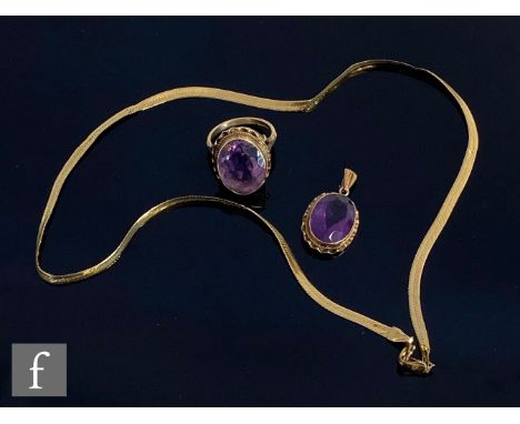 A 9ct foxtail link chain, weight 3g, with a 9ct mounted amethyst pendant and a 9ct amethyst ring, total weight 8.5g, S/D. (3)