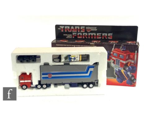 A Habsro Transformers G1 Optimus Prime, appears complete with instruction leaflet, boxed. 