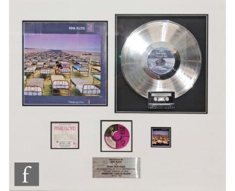 A framed Pink Floyd display montage, with plaque 'Presented by Pink Floyd to Storm Thorgerson in recognition of your contribu