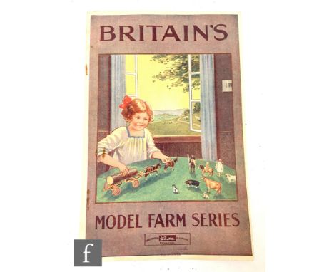 A 1930s Britain's Model Farm Series catalogue leaflet, illustrated with a colour image of a boy playing with a farm wagon at 