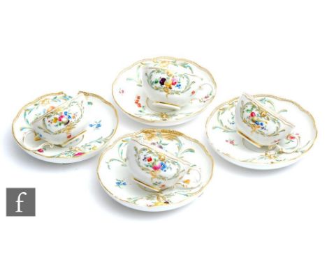 Four 19th Century Meissen teacups and saucers, each with hand painted fruit and floral sprays with gilt and turquoise scrolls