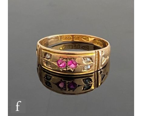 An early 20th Century 15ct hallmarked ruby and diamond six stone ring, two rubies flanked by pairs of diamonds, weight 2.1g, 