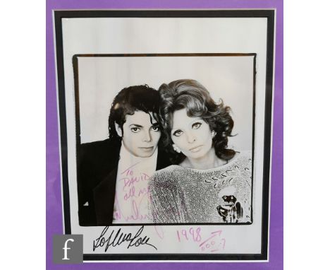A signed Michael Jackson photograph, the black and white photograph of Michael Jackson and Sophia Loren, signed 'To David, al