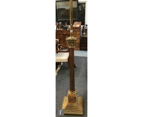 A late 19th Century brass and copper Corinthian column adjustable standard lamp and shade on stepped square base, height 188c