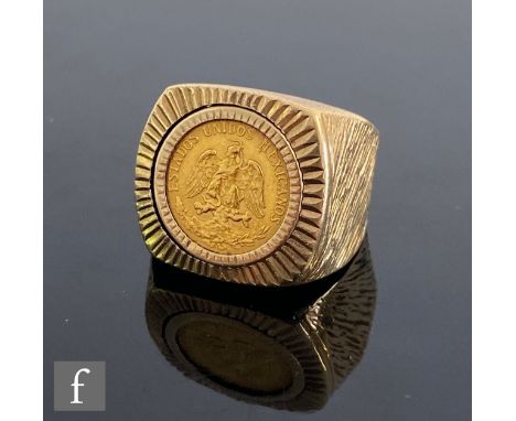 A 9ct hallmarked bark finish ring with central Mexican two Pesos coin dated 1945 to centre, total weight 9.5g, ring size K. 