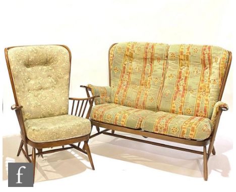 An Ercol Furniture beech framed model 203 Windsor bergere two-seat settee or sofa, together with a model 203 Windsor bergere 