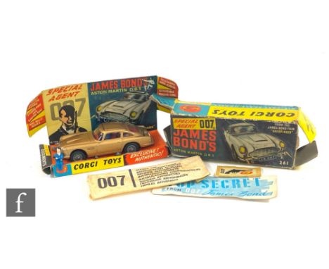 A Corgi 261 James Bond Goldfinger Aston Martin DB5 with gold body, red interior and wire wheel, with James Bond and Bandit fi