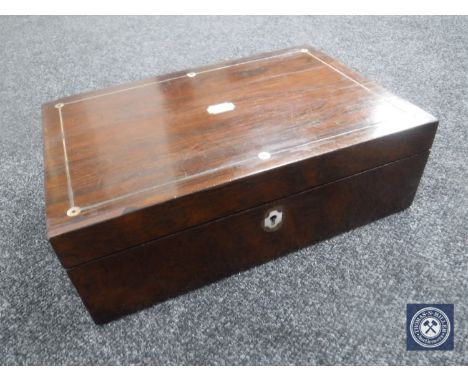 A Victorian rosewood writing box inset with mother of pearl