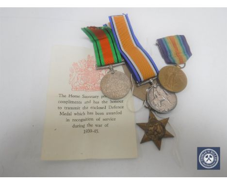Four service medals to include 1914-1918 British War Medal awarded to PTE. R. E. Smith, Durham Light Infantry 92065, Africa S