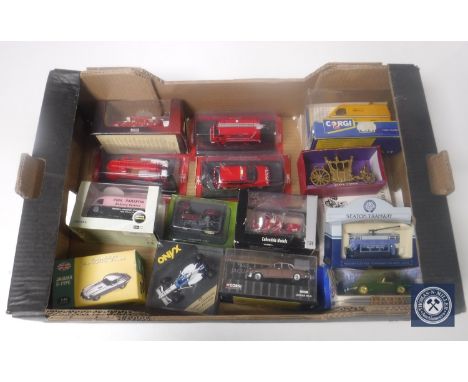 A box containing a collection of die cast vehicles, emergency response vehicles, Dinky, Corgi etc