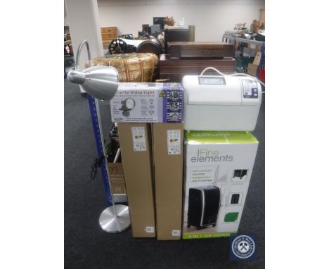 A bread maker together with an air cooler/heater/purifier, floor lamp, security video light etc