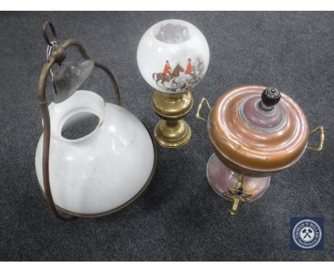 A copper samovar together with a ship's lamp with glass shade and a brass oil lamp
