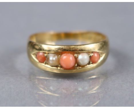 A Victorian 18ct gold ring set coral beads with split pearls in-between, London hallmarks for 1882; size Q/R; 4.2gm.