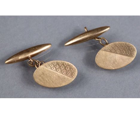 A pair of 9ct gold cufflinks with oval engine-turned panels; 3.8gm.
