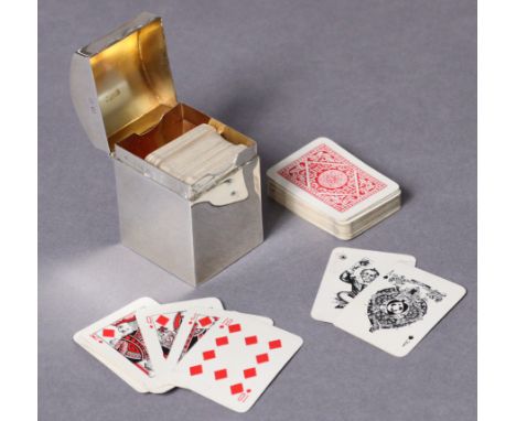 A George V silver rectangular playing cards box with domed hinged lid, containing two complete packs of small size playing ca