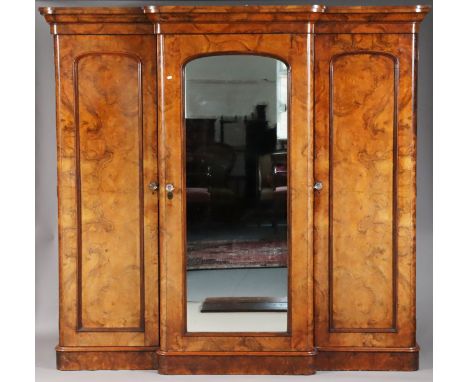 MAPLE &amp; CO, LONDON. A Victorian burr-walnut triple wardrobe with moulded cornice, fitted with sliding trays &amp; graduat