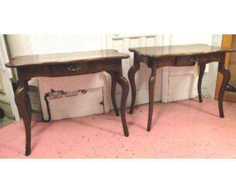 CONSOLE TABLES, a pair, 18th century Italian walnut, each serpentine fronted with drawer and carved cabriole supports with ho